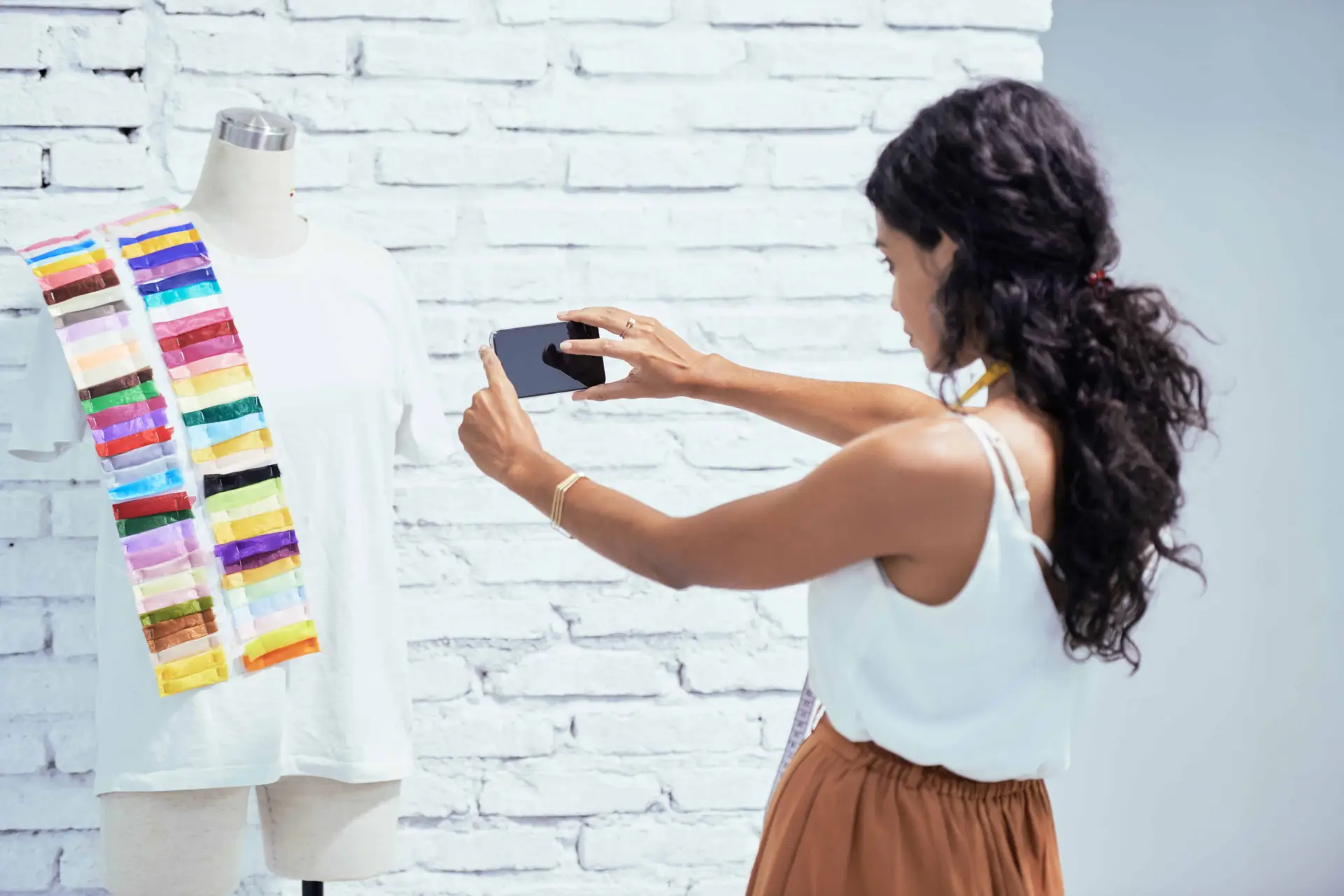 woman taking photo of scarf