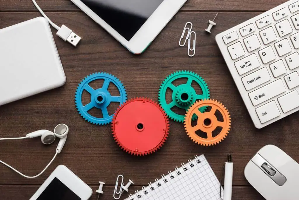 colorful gears and gadgets next to a laptop on Dogwood Journal homepage