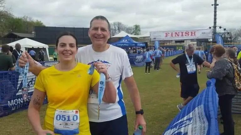 James and his daughter after completing a race