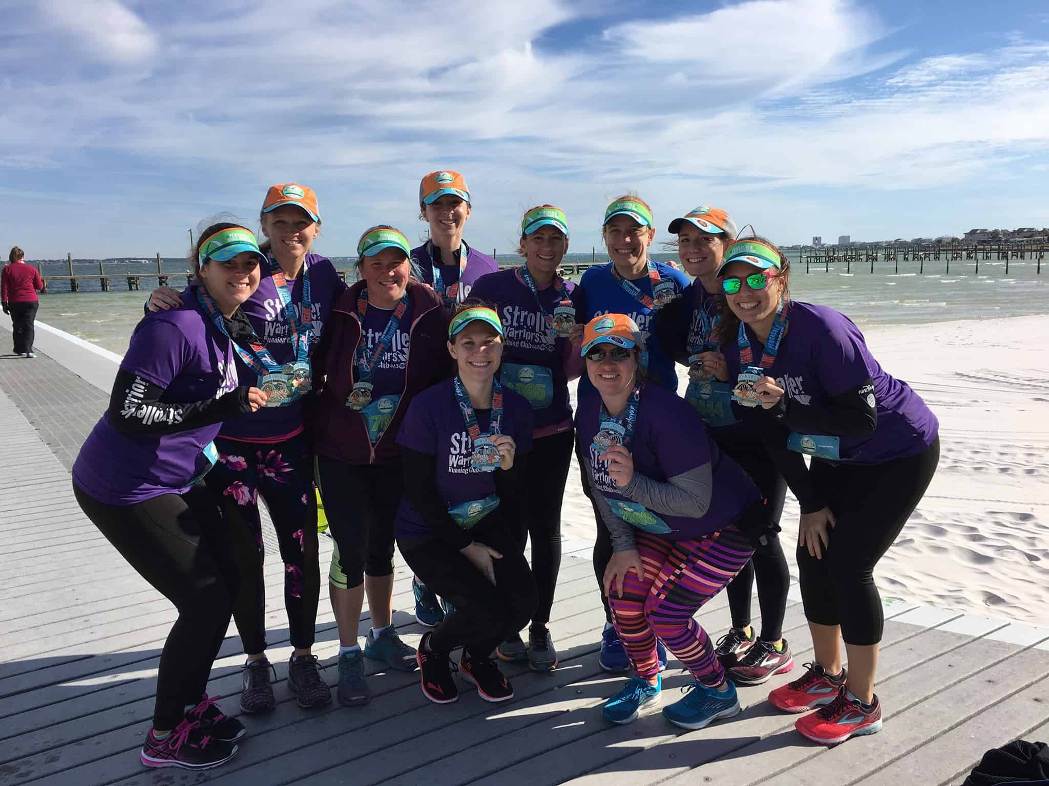 group of women posing with medals