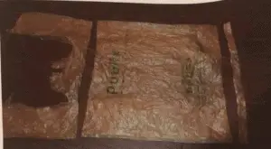 a plastic bag showing cut pattern to be woven for a homeless person to sleep on