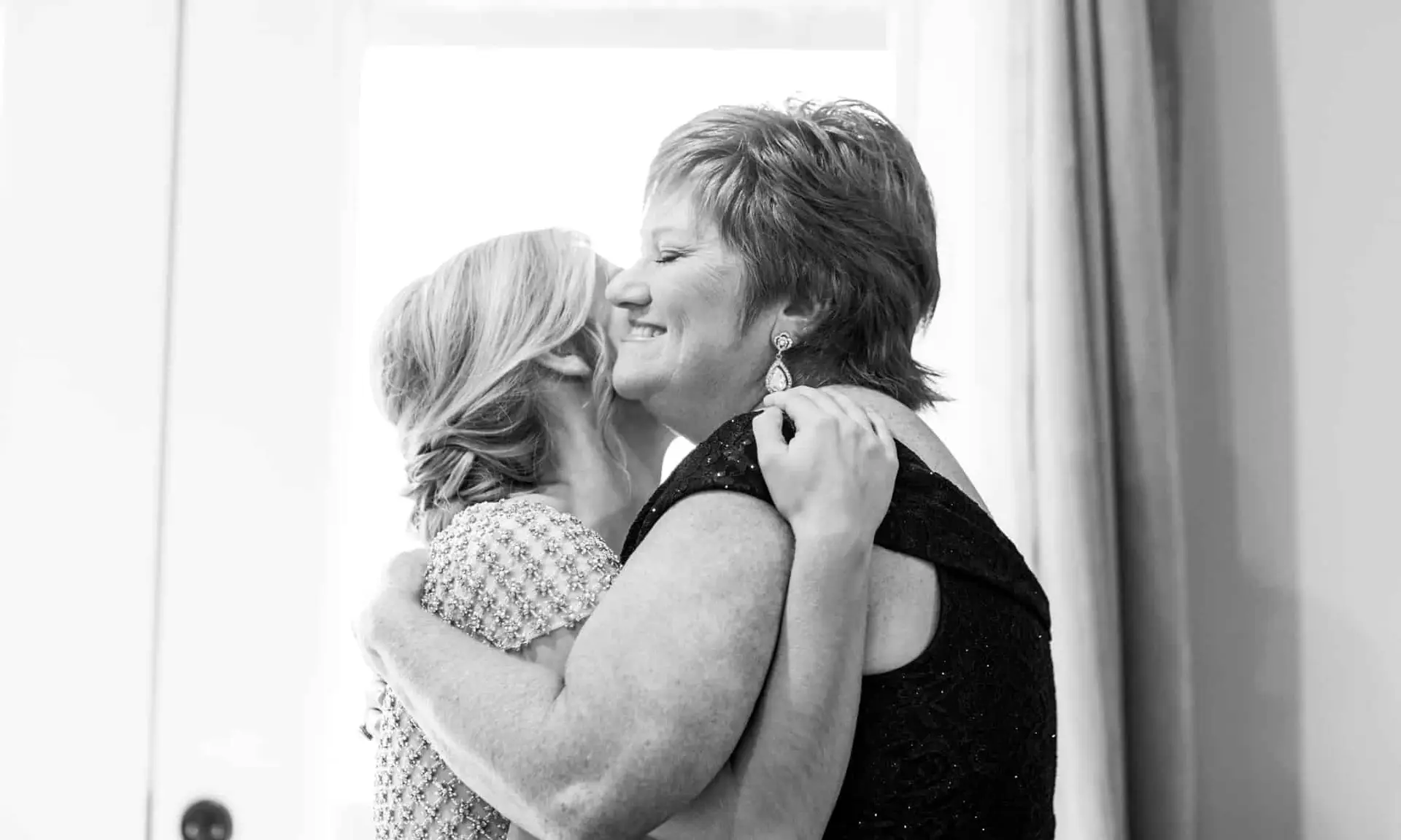 mom and daughter hugging