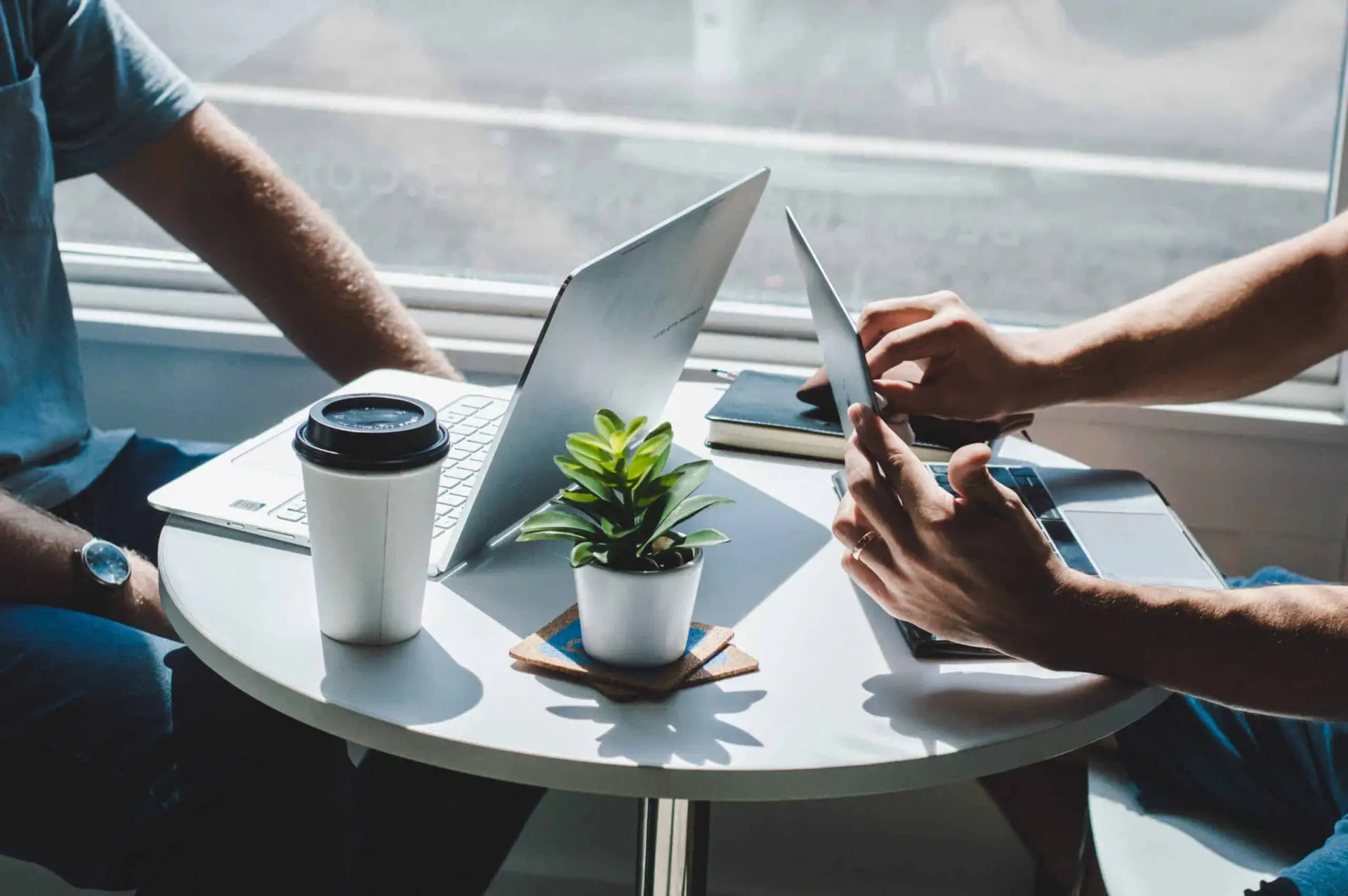 two people on laptops