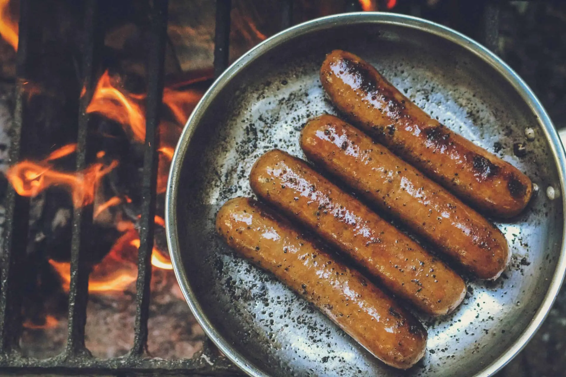 venison sausages on grill