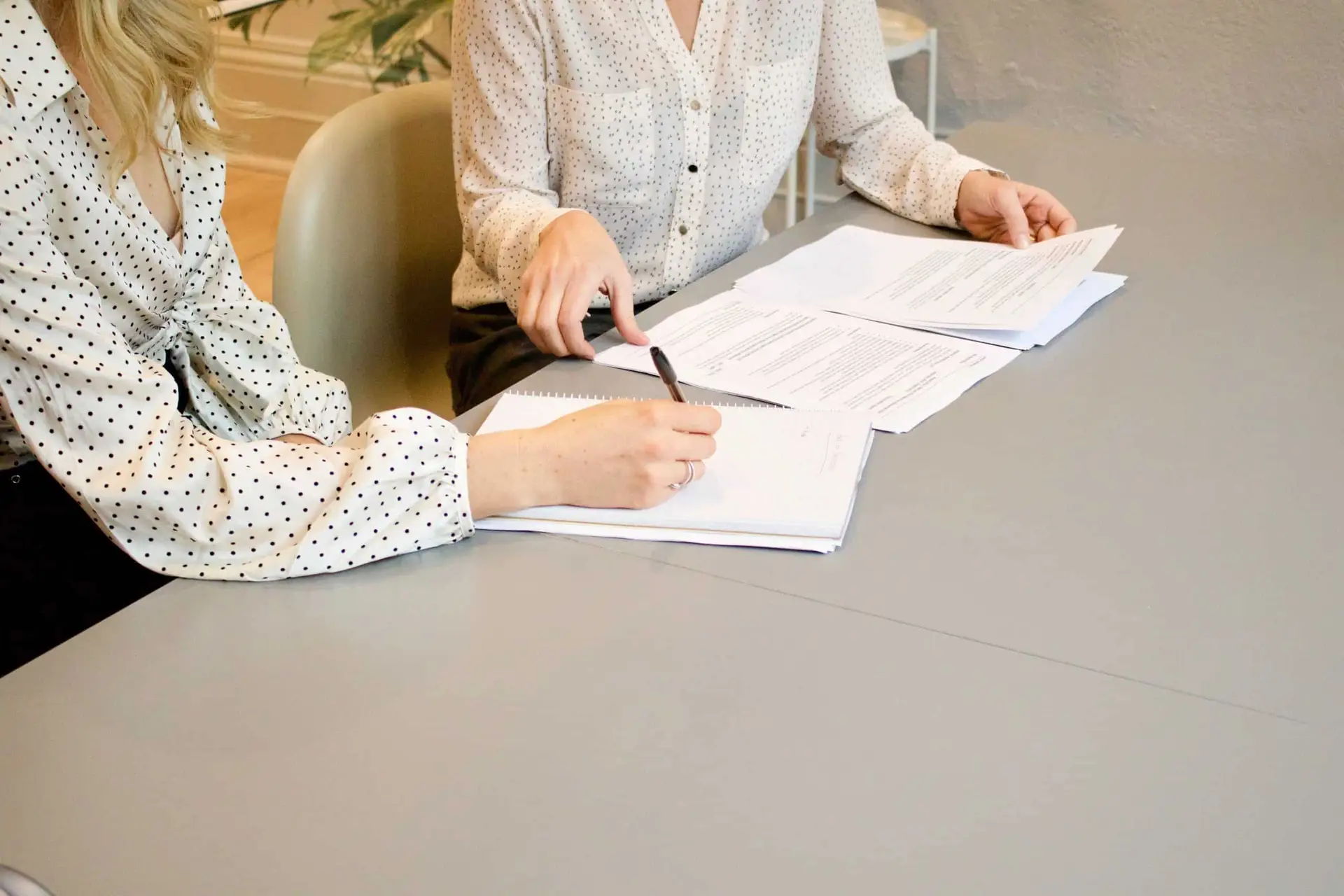 two women reviewing resumes