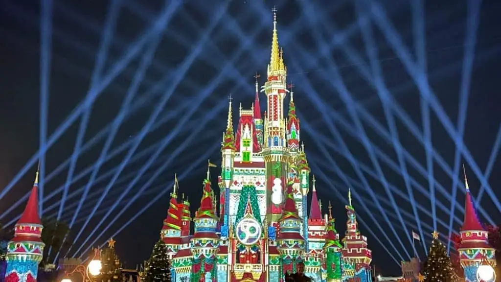 cinderella's castle at disney world lit up for Christmas