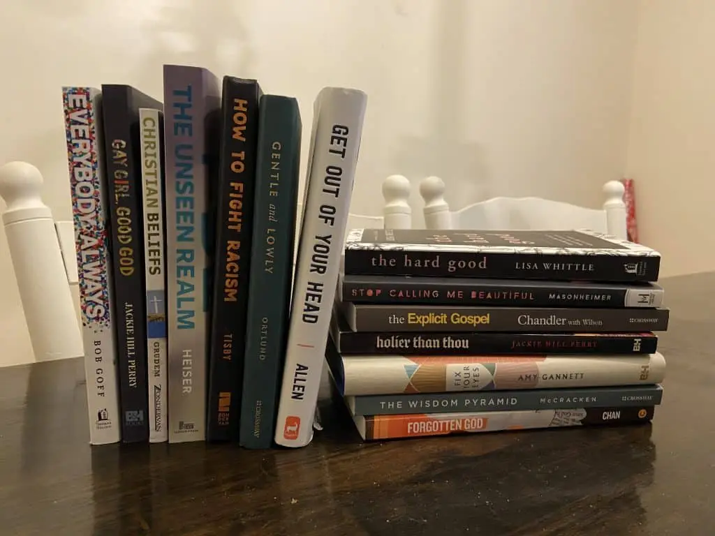 stacks of books on table to show what author read in 2021