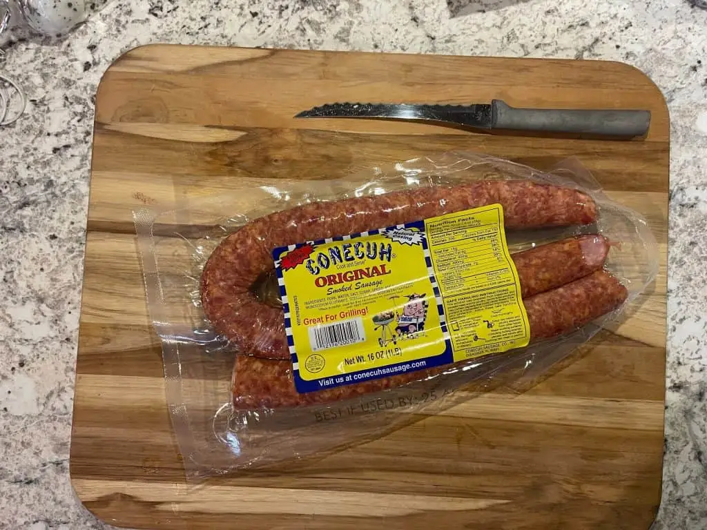 package of conecuh sausage on a wooden cutting board